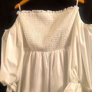 This white peasant cut out sleeve is summertime it